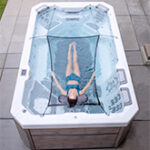 Lady Relaxing in Bullfrog Spas Swim Series